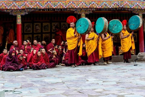 Monks making music as part of the opening ceremony of the Hemis Festival