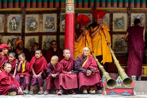 Monks making music as part of the opening ceremony of the Hemis Festival