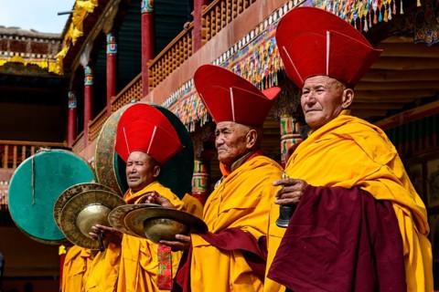 Monks making music as part of the opening ceremony of the Hemis Festival
