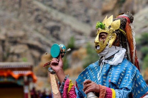 Monk performing ritual mask dance