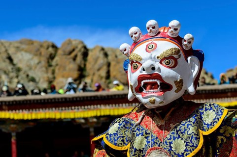Monk performing ritual mask dance
