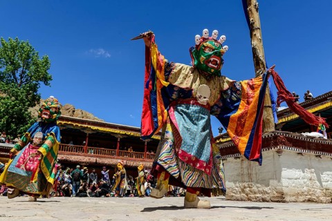 Monks performing ritual mask dance