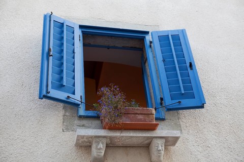 Window with blue shutters