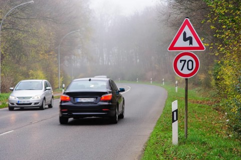 Traffic signs before a curve