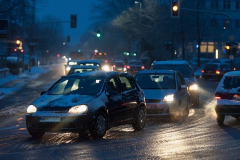 Road traffic in the city on a winter morning