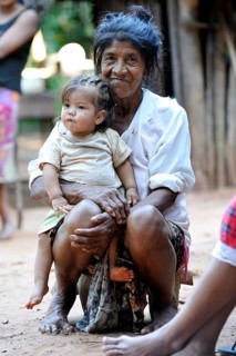 Elderly woman with a child on her lap