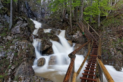 Wooden bridge and a waterfall in Baerenschuetzklamm gorge
