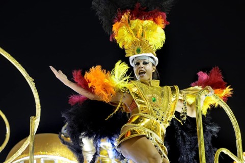 Dancer on a float in a colourful costume