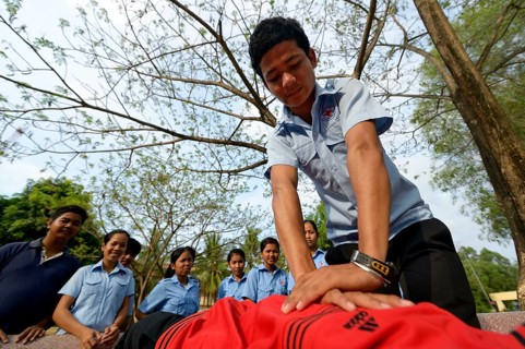 Youth performing a resuscitation procedure