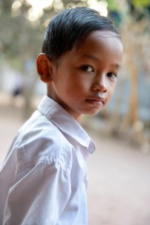 Schoolboy with his combed hair back