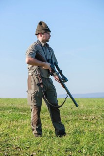 Hunter standing on a meadow