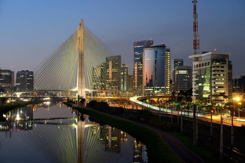 Modern skyscrapers and the Octavio Frias de Oliveira bridge over the Rio Pinheiros River at night