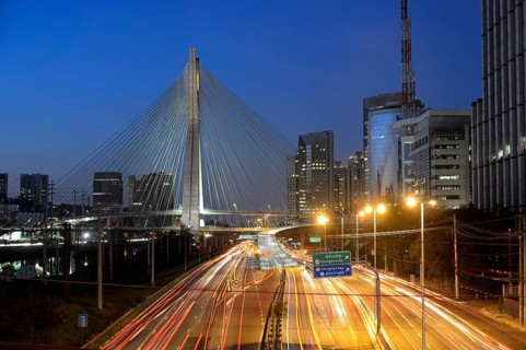 Modern skyscrapers and the Octavio Frias de Oliveira bridge over the Rio Pinheiros River at night