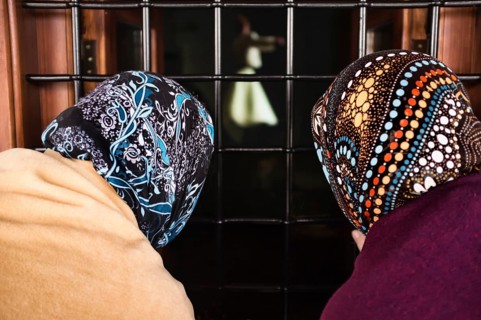 Women looking through a window