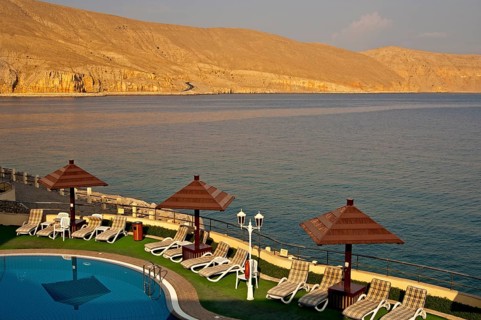 View of the coast of the Musandram Peninsula from the swimming pool area at the Golden Tulip Resort Hotel
