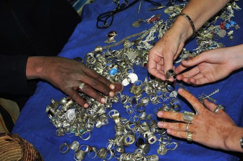 Female hands touching silver Berber jewellery