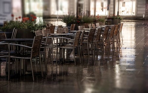 Wet restaurant chairs and restaurant tables