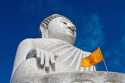 Great Buddha with a yellow Dharmacakra flag