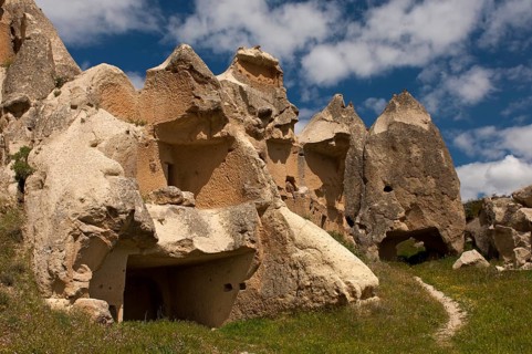 Heavily eroded tuff cones with the remains of storage spaces