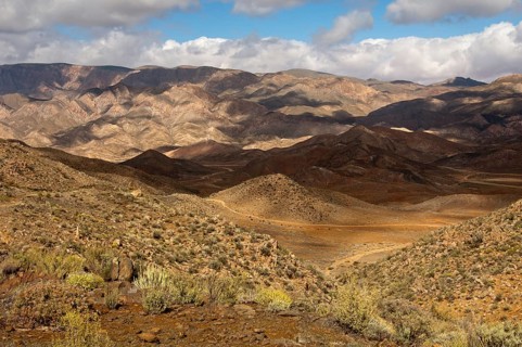 Light and shadows in a broad landscape with hills