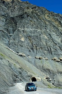 Car on Sanetsch Pass road with road tunnel