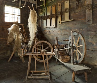 Spinning wheels in a farmhouse room