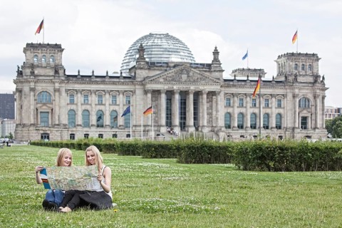 Two young women studying a map of Berlin
