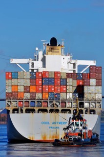Container ship OOCL Antwerp with the tug Bugsier 10 at Koehlbrand in the Elbe River