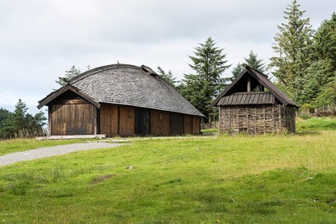 Reconstructed Viking farm with a long house and a fire building