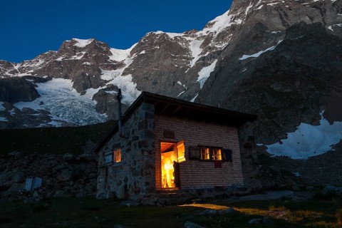 Schmadrihuette mountain hut illuminated at dusk