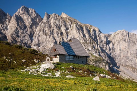 Rifugio Garelli mountain hut in front of the northern face of Punta Marguareis Mountain