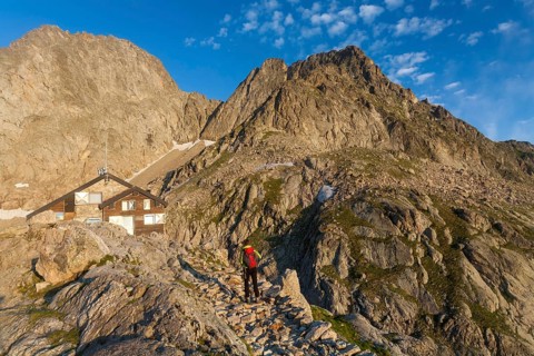 Hiker at Rifugio Pagari mountain hut