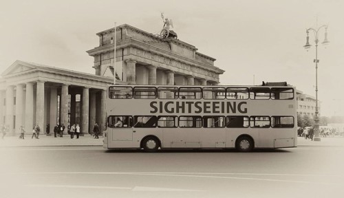 Sightseeing bus for a city tour in front of the Brandenburg Gate