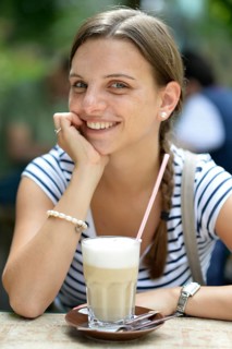Young woman with a latte macchiato