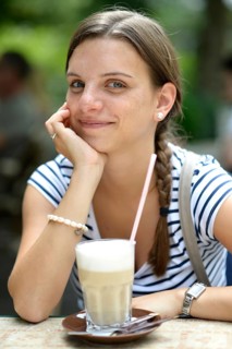 Young woman with a latte macchiato