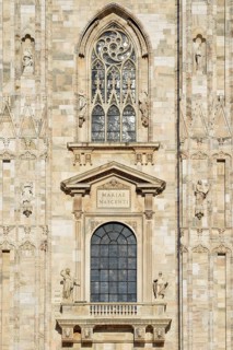 Window over the main portal of the west facade of Milan Cathedral or Duomo di Santa Maria Nascente