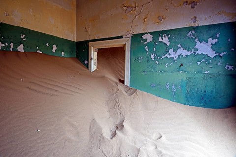 Building taken over by sand from the desert