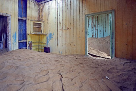 Building taken over by sand from the desert