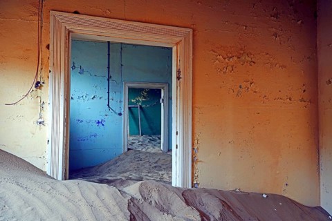 Building taken over by sand from the desert