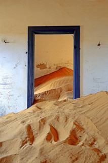 Building taken over by sand from the desert