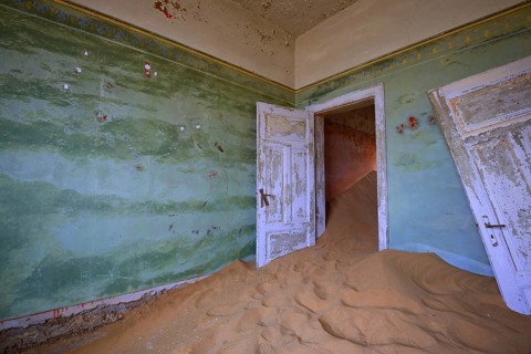 Building taken over by sand from the desert