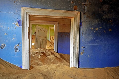 Building taken over by sand from the desert
