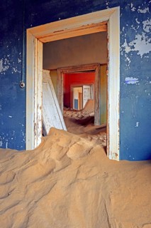 Building taken over by sand from the desert