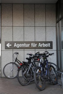 Bicycles parked in front of the sign 'Agentur fuer Arbeit'