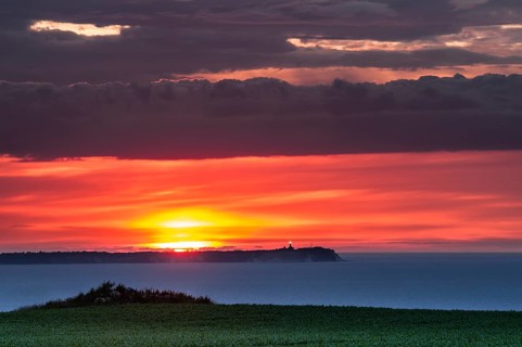 Views towards Cape Arkona with a lighthouse at sunset