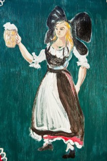 Painted window shutter with woman in traditional costume