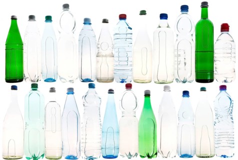 Different varieties of mineral water in bottles made of glass and plastic or PET