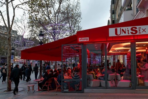 Sidewalk cafe on the Avenue des Champs Elysees street in the evening