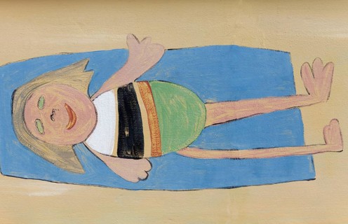 Girl lying on a beach towel