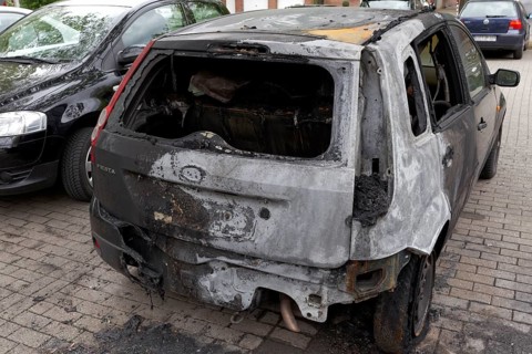 Burnt out Ford Fiesta in a car park